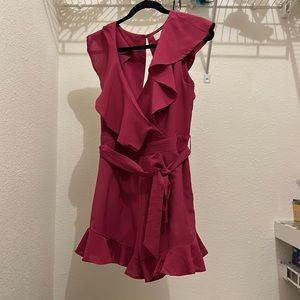 This is a fuchsia pink romper,medium